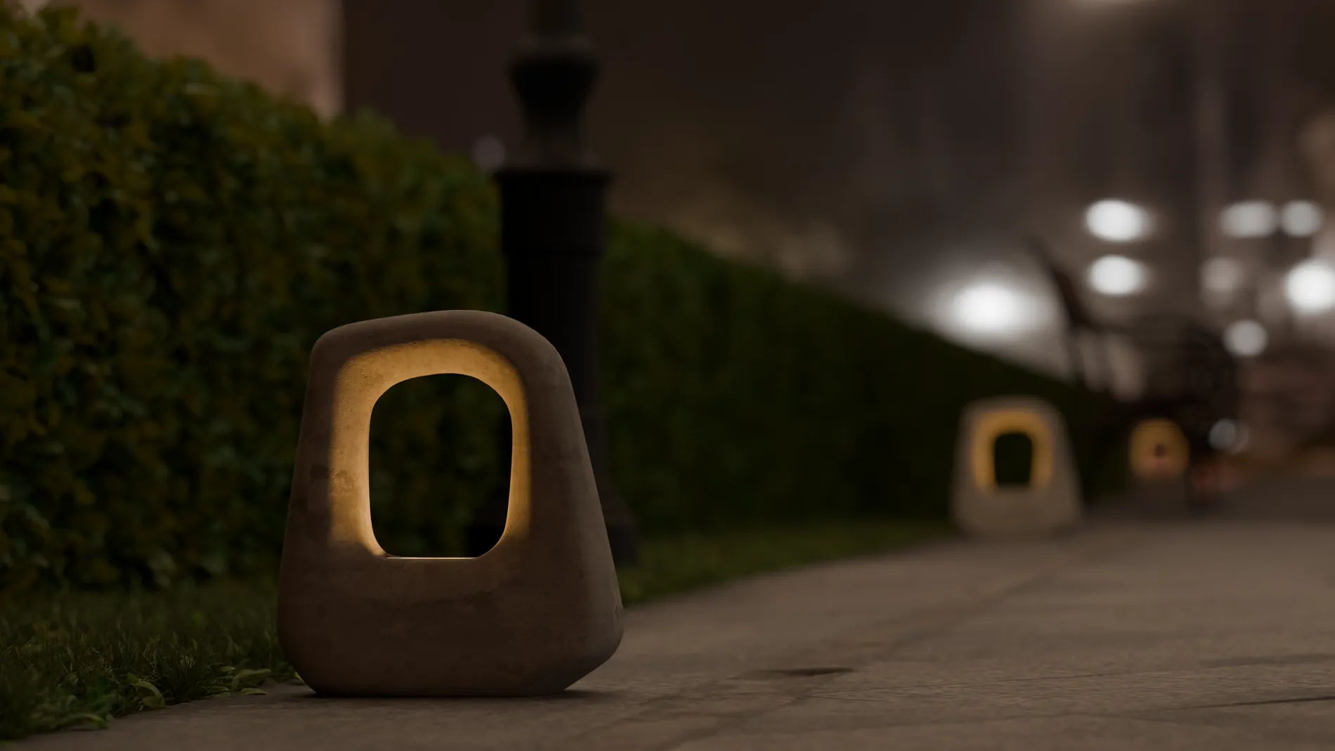 Bolardo de cemento con iluminación en un sendero nocturno